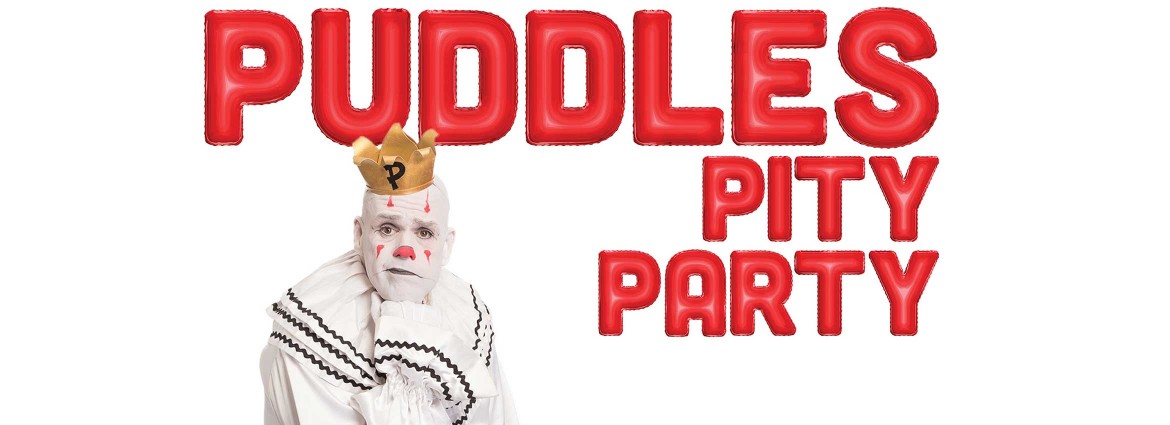 Puddles the Clown with chin resing on fist to promote Puddles Pity Party