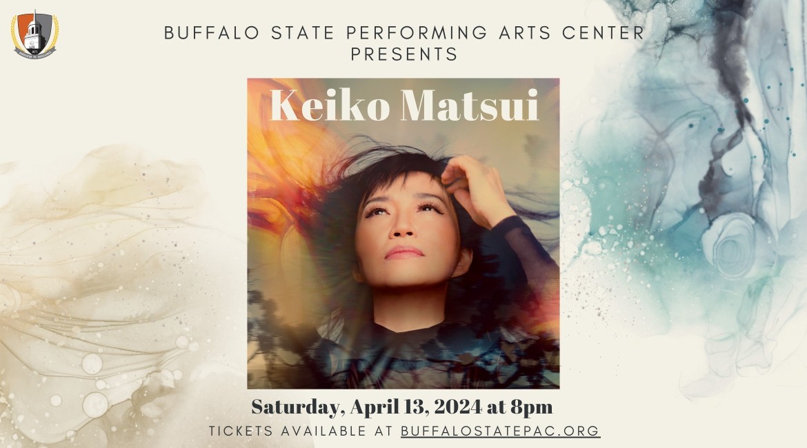 Keiko Matsui looking up to her right