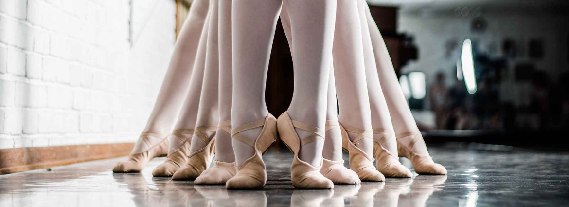 feet in ballet slippers