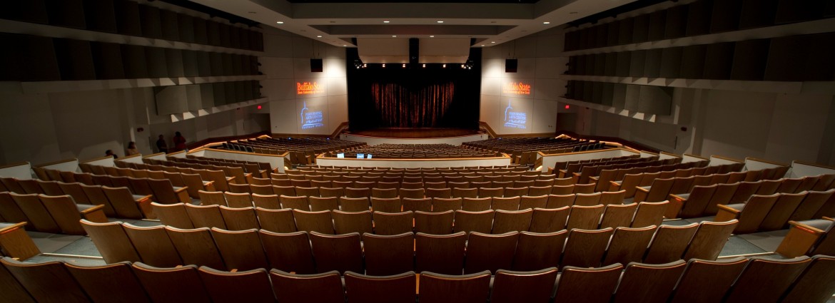 View of Performing Arts Center seating and stage from rear of auditorium