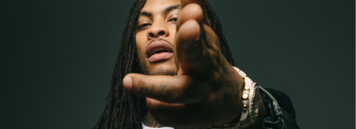 Waka Flocka Flame holding hand out
