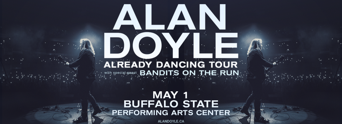 Alan Doyle on stage with guitar